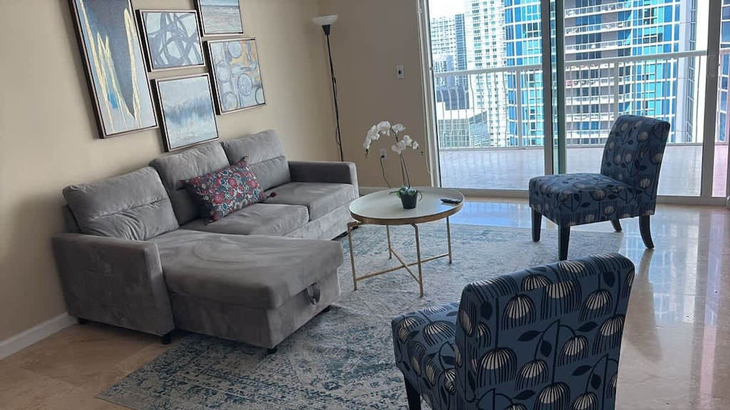 Airy living space with a sleep sofa and direct balcony access