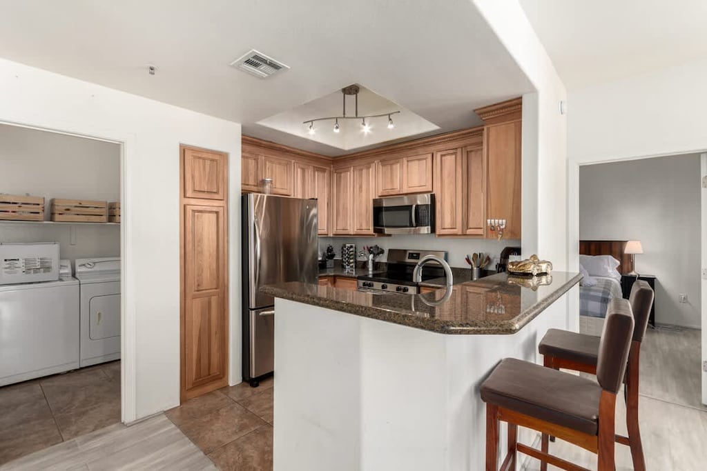 Fully equipped kitchen with modern appliances and plenty of counter space.
