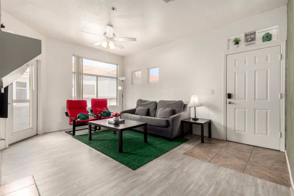 Bright living space with cozy seating and Smart TV.