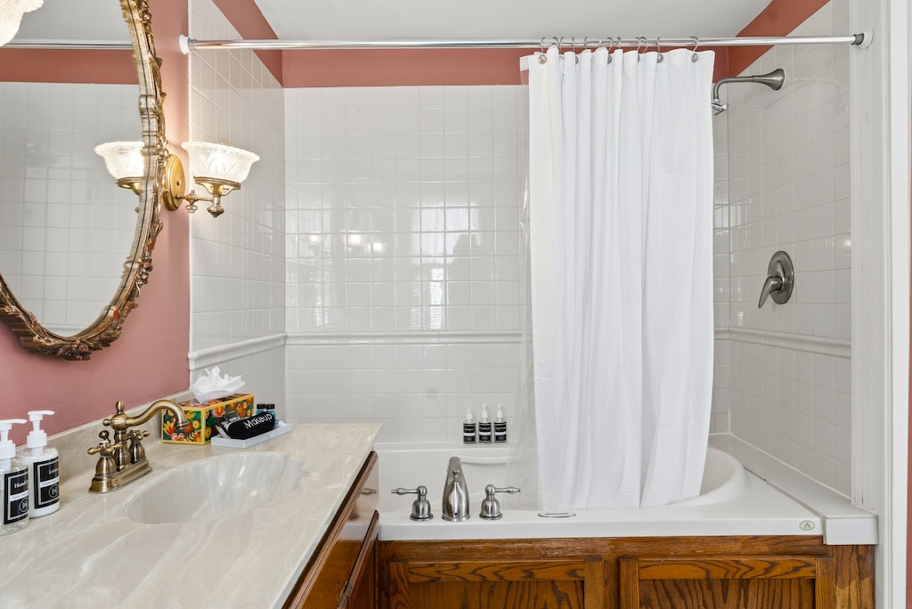 Step into your private bathroom featuring a luxurious soaking tub, refreshing shower, and charming vintage details that make every morning feel special.