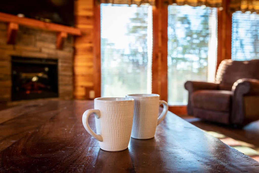 Sip your morning brew by the fireplace with stunning nature views!