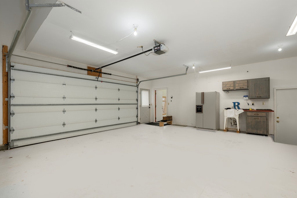 Spacious garage with convenient kitchen area offers extra storage and prep space for your stay.
