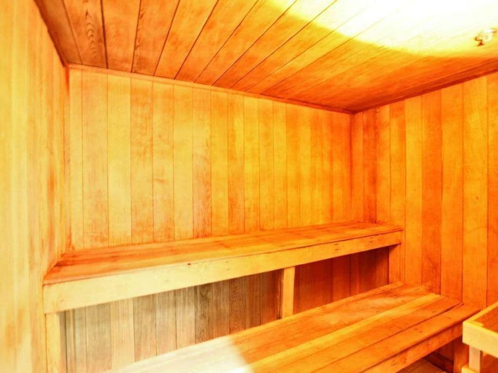 Unwind in the wooden sauna, where warm cedar envelops you in tranquil heat therapy.