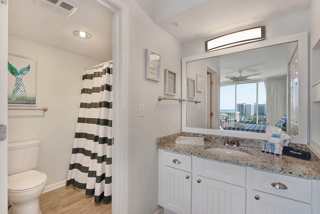 Freshen up in your bright bathroom with granite counters and city views through the mirror.
