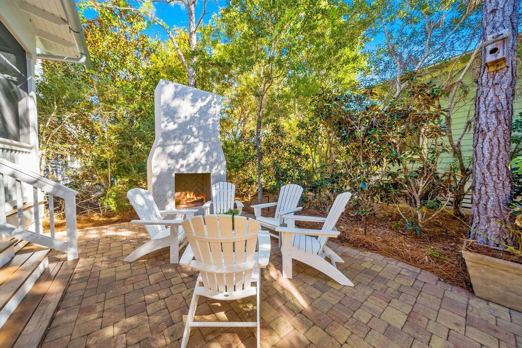 Your private outdoor fireplace with comfortable Adirondack chairs on the peaceful brick patio.