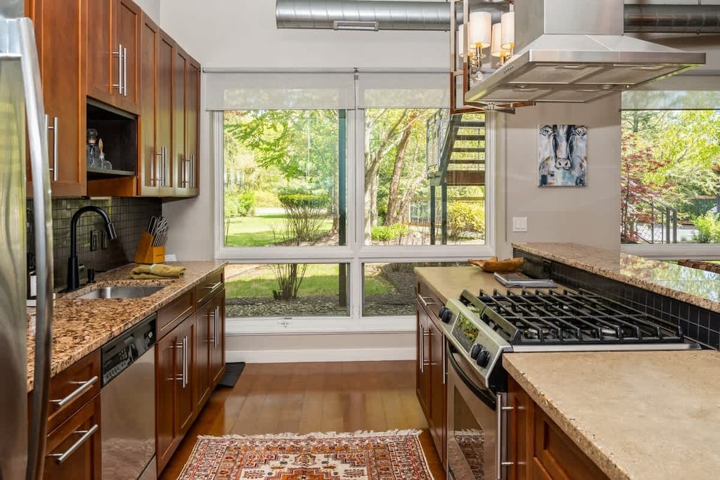 Sunlit kitchen with scenic views and chef-worthy style!