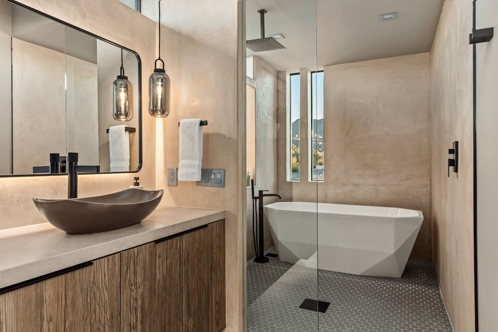 Primary bath features a soaking tub and duel-system jet shower.