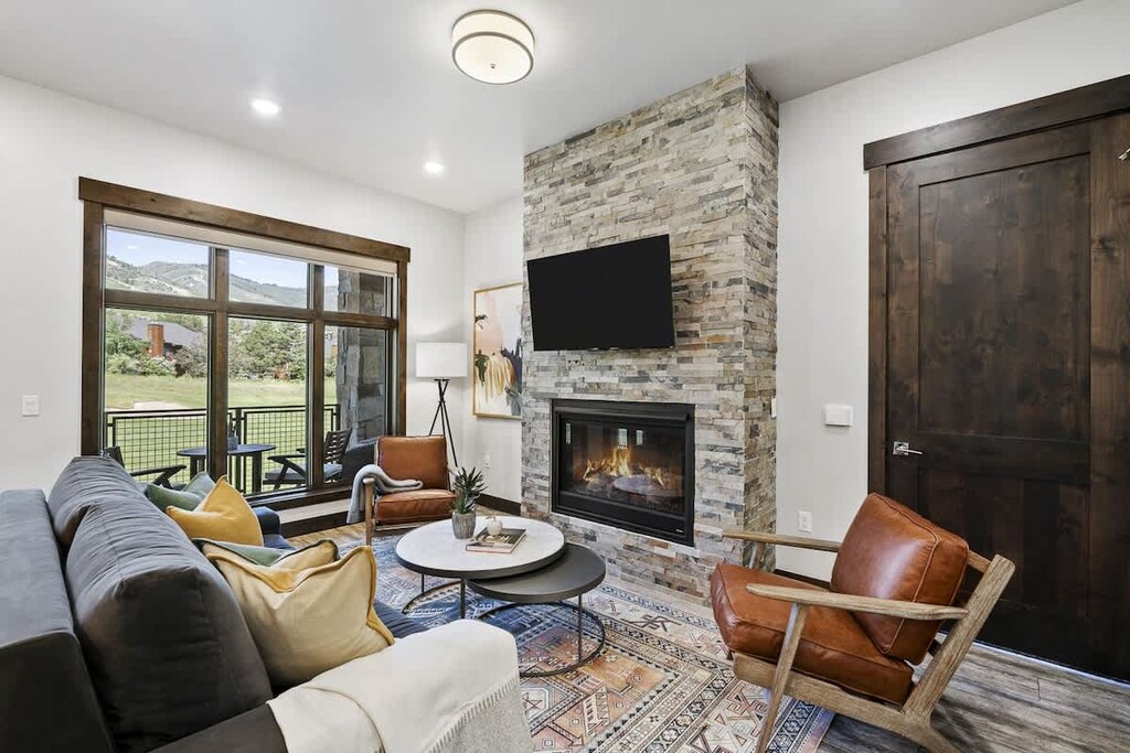 American Leather fabric queen sofa sleeper, fireplace, Roku TV, and Xfinity cable.