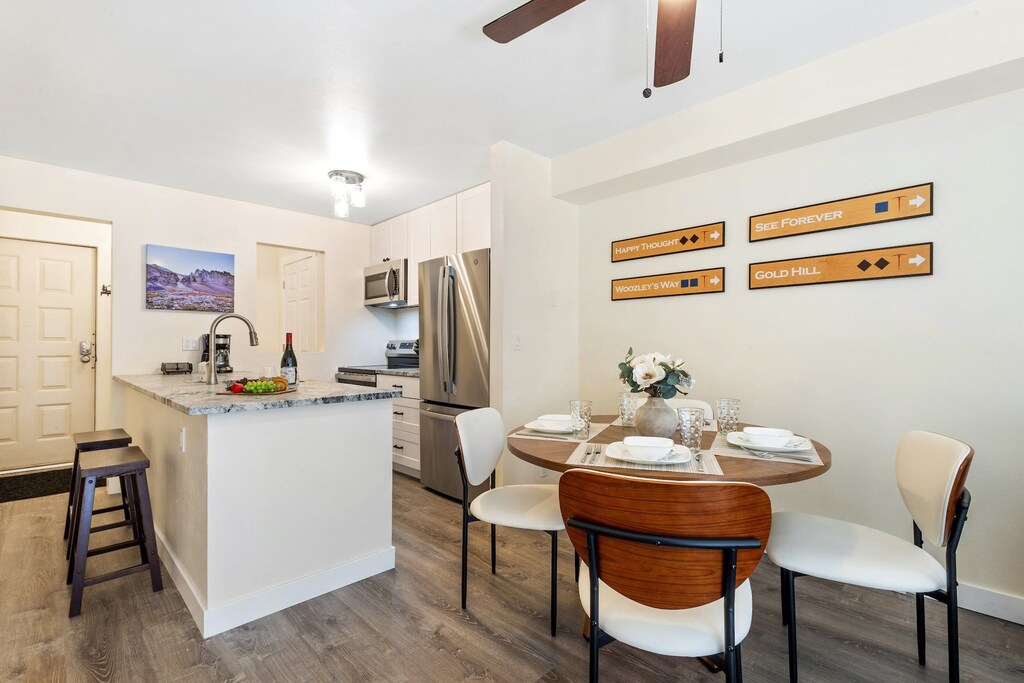 Open concept living-dining-living area- features dining for 4 as well as bar seating for two.