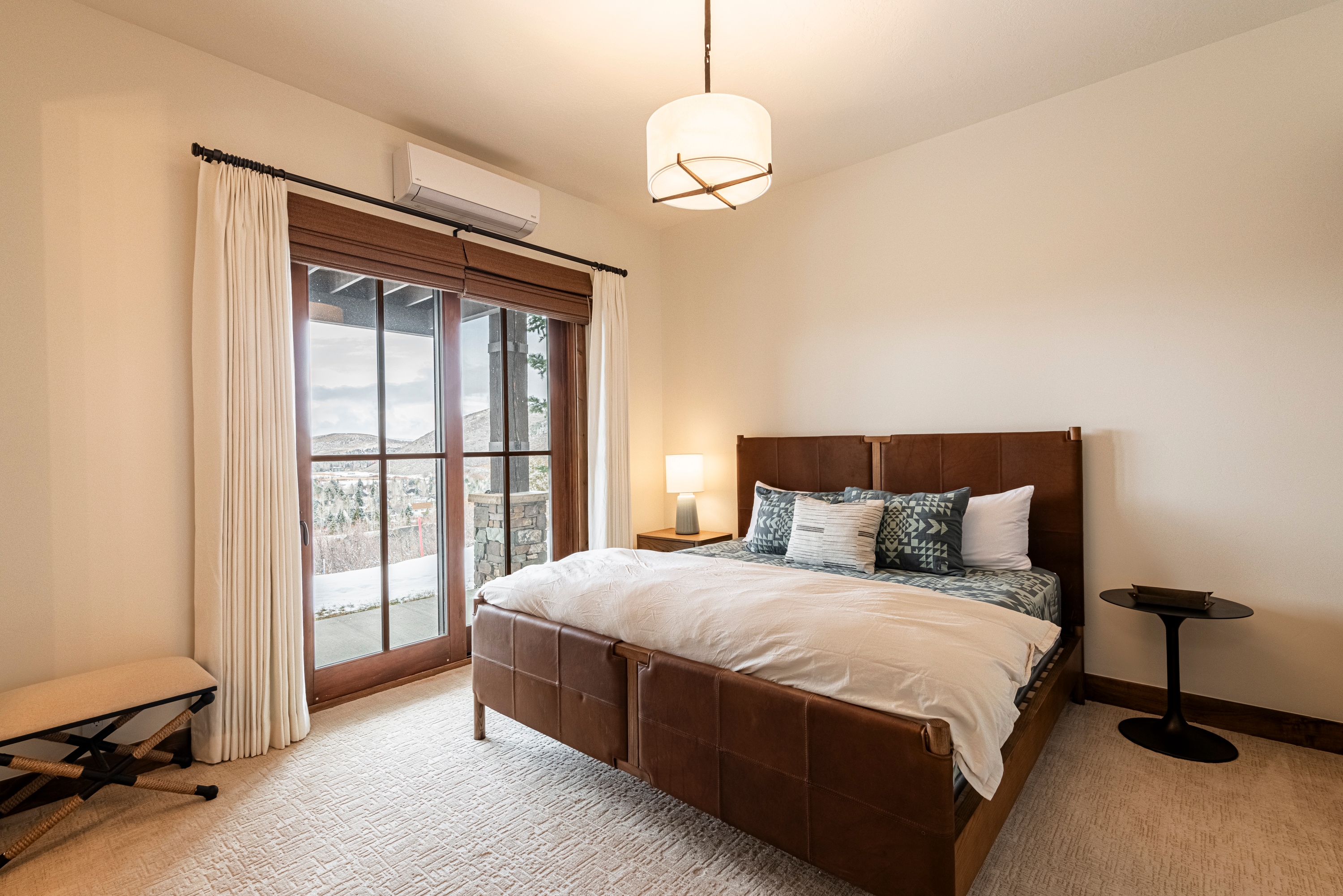 Lower level master bedroom 3 with a king bed and expansive views