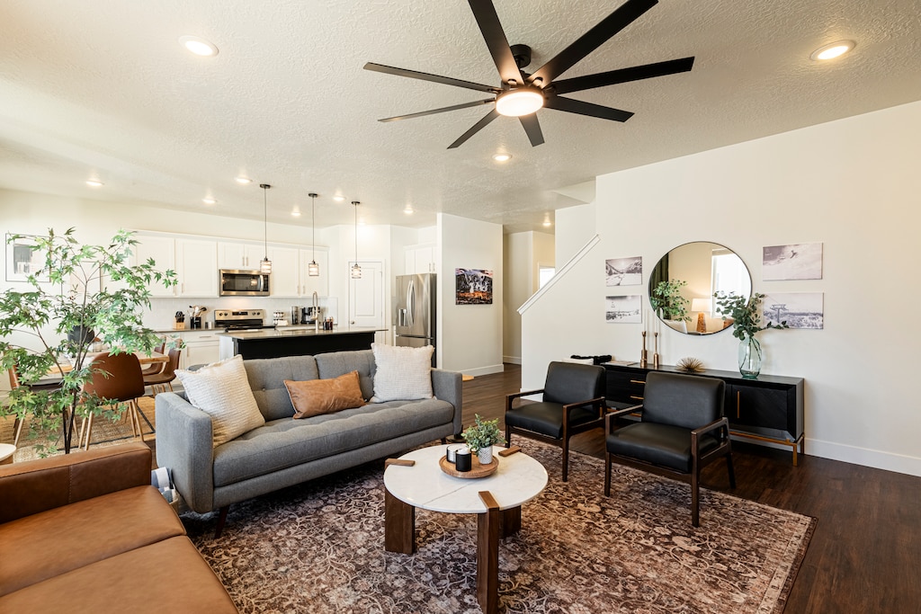 Living area facing kitchen and dining