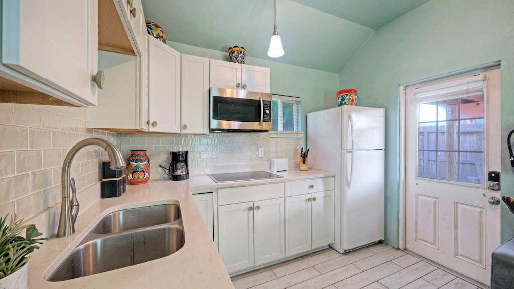 Functional kitchenette with ample counter space.