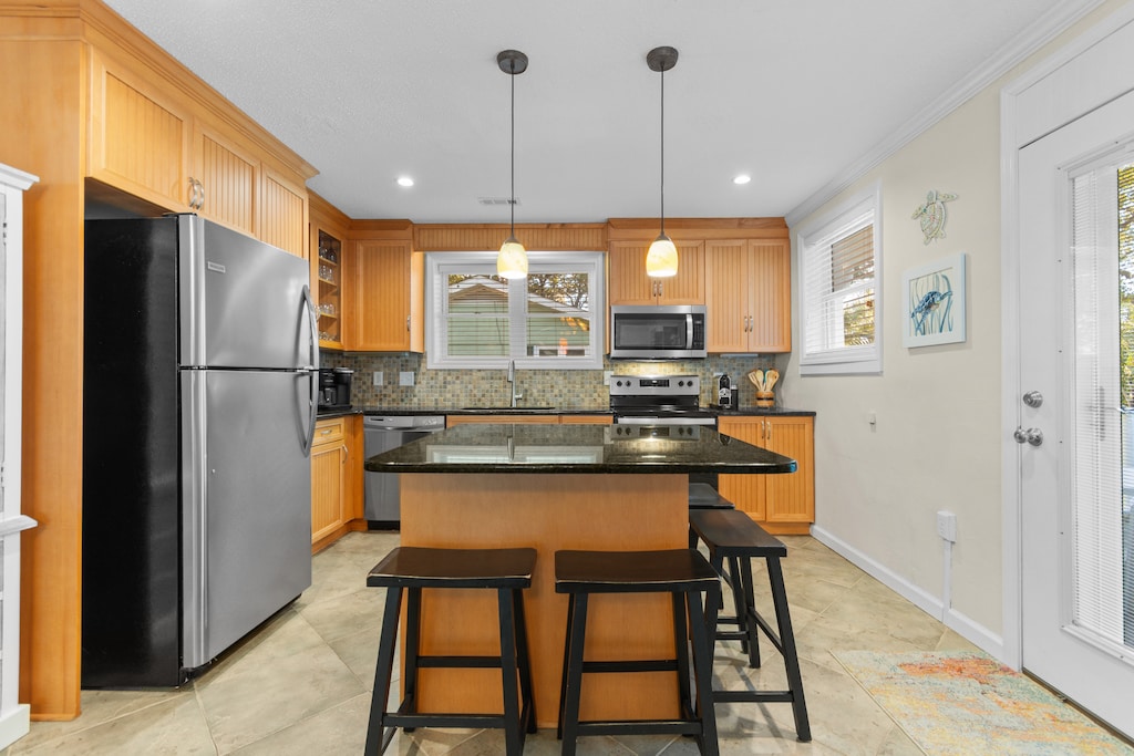 Your fully-equipped kitchen awaits with granite counters, stainless appliances, and a breakfast island where you can start each morning perfectly.