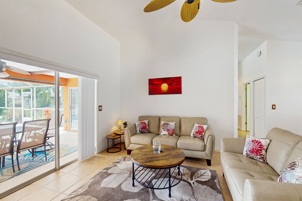 Bright & airy living room with sliding glass doors that lead to outdoor patio
