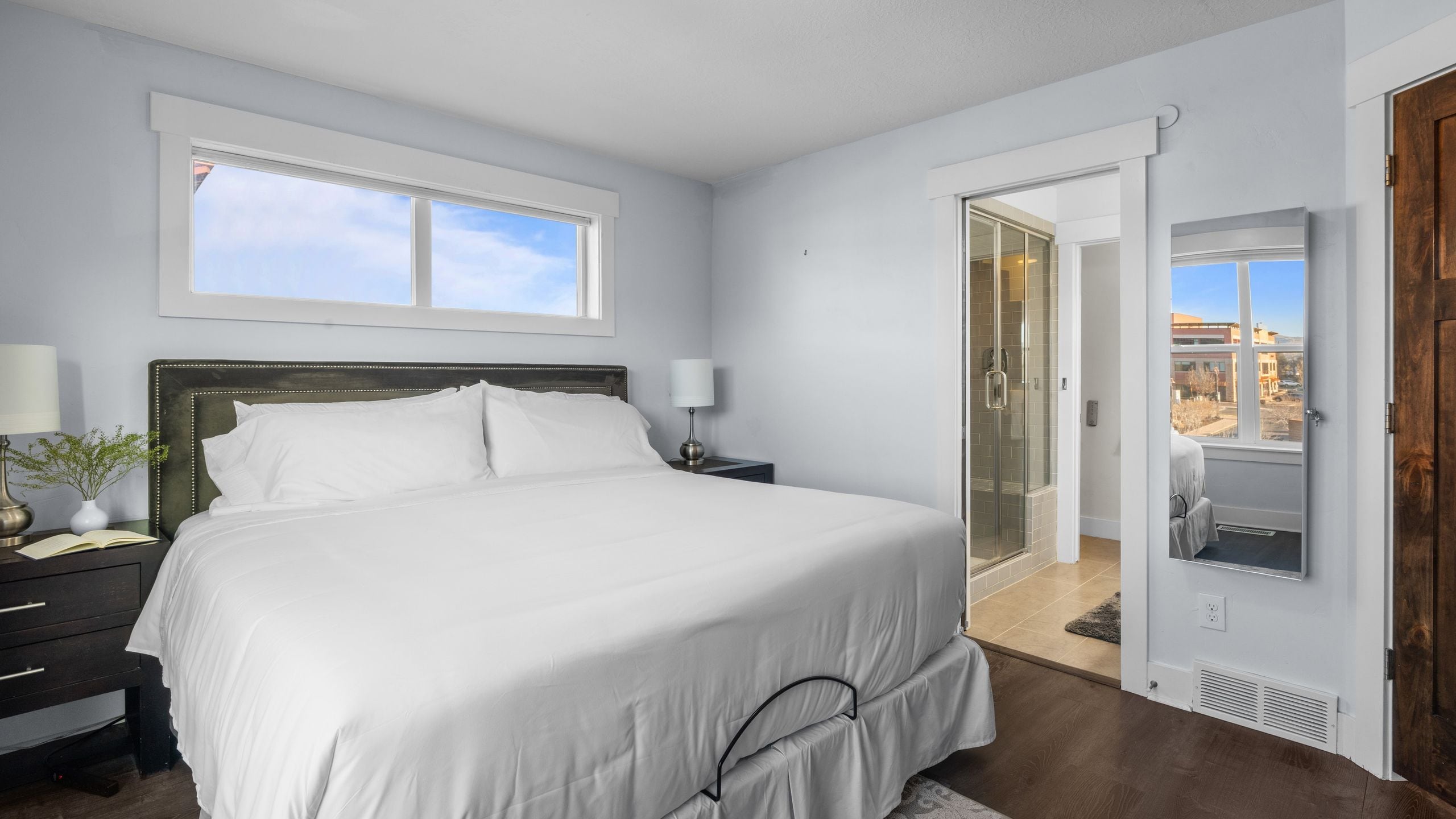 The primary bedroom features a king bed and an ensuite bathroom.