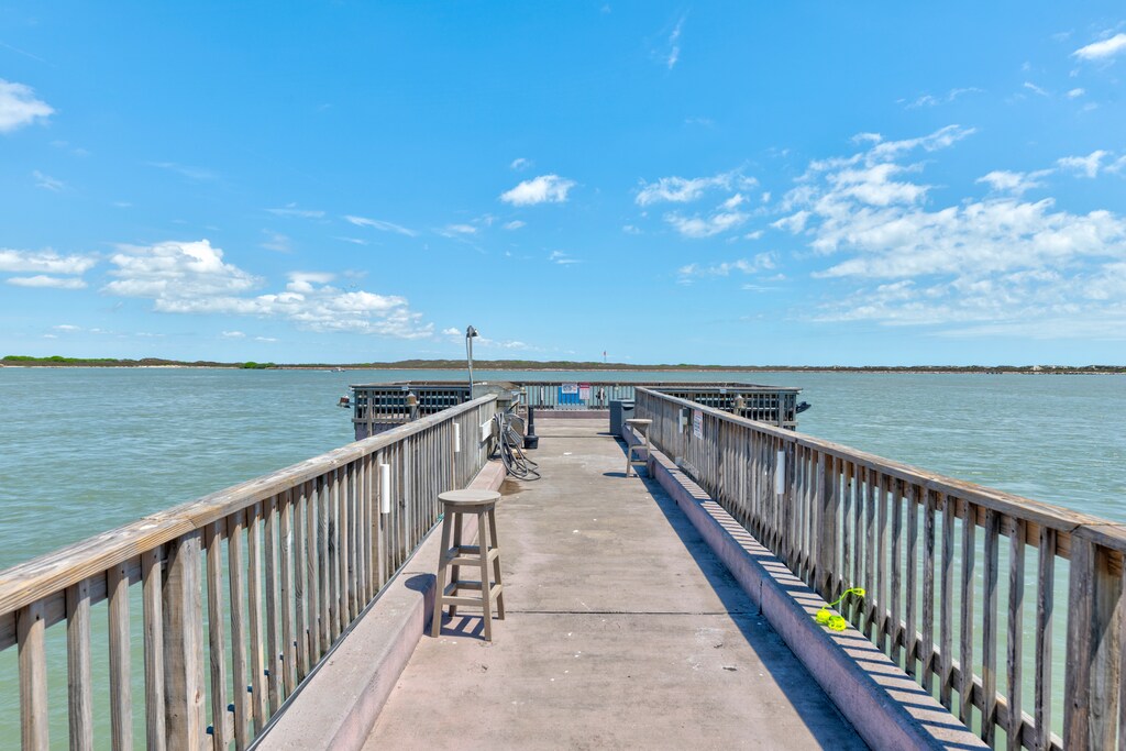 Waterfront homes line a peaceful bay with private dock access and stunning coastal views.