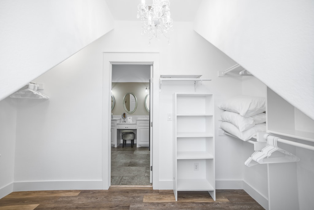 Your private attic retreat features elegant built-in storage and a stunning ensuite with vintage charm.