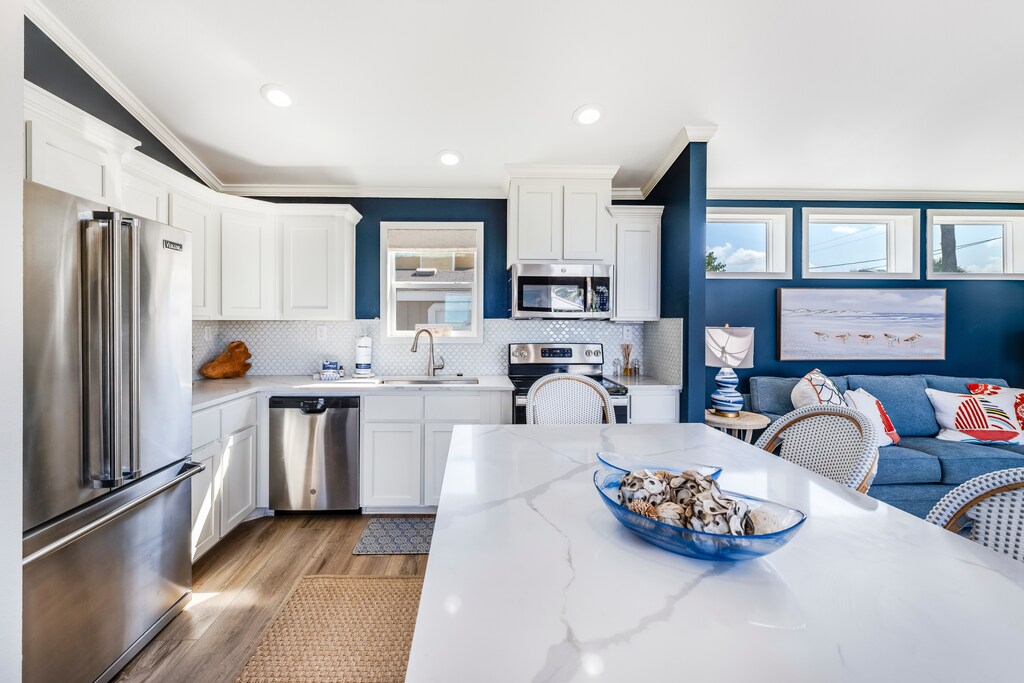 Your spacious open-concept living flows seamlessly from modern kitchen to cozy living area, perfect for gathering and creating memories.