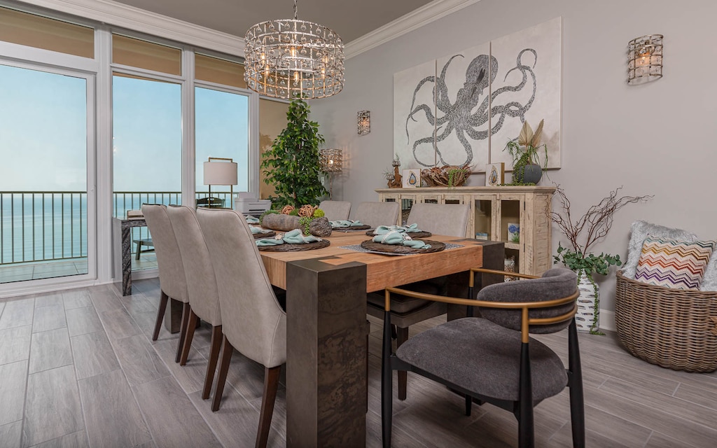 Settle into a dining chair and enjoy gulf views through tall glass doors to the balcony