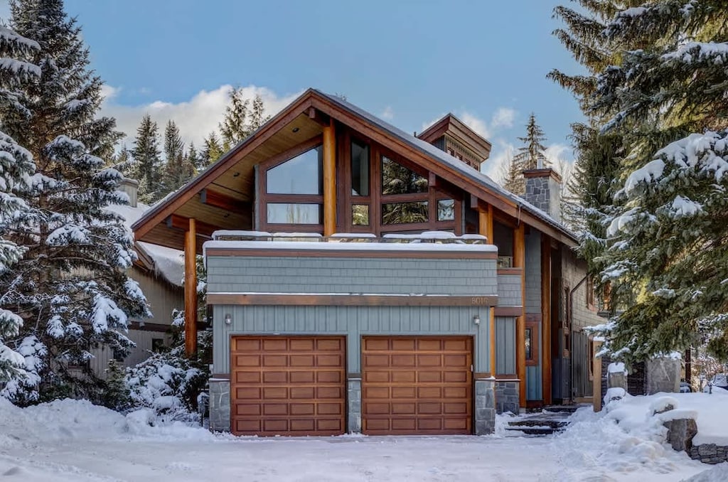 - Stunning log cabin exterior framed by snow and evergreens  
- Modern mountain retreat combining rustic timber and glass design  
- Perfect photo-worthy stay for all-season mountain getaways  