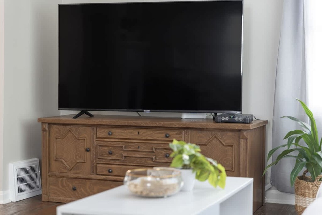 Step into comfort and style in this inviting living room featuring sleek hardwood floors and a plush couch. The perfect space to snuggle up with a good book or binge-watch your favorite shows.