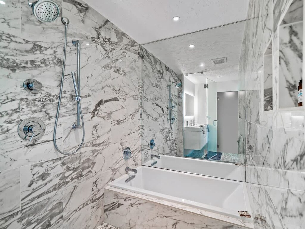 Relax and unwind in our serene bathroom sanctuary, where the ambiance is as inviting as the luxurious amenities.