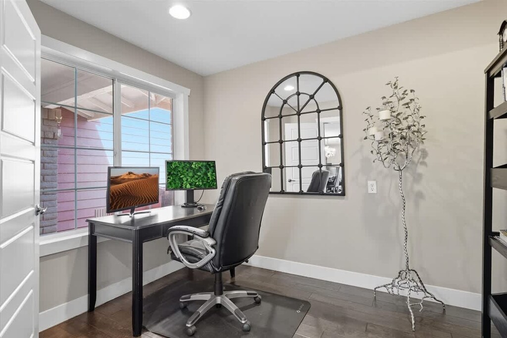 Office with a desk, chair, and 2 computer monitors.