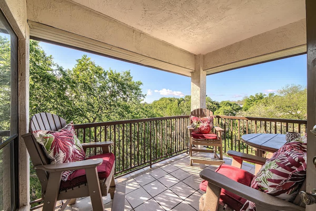 Breathe in the fresh air amidst the tree tops and enjoy the view of the Comal River below.