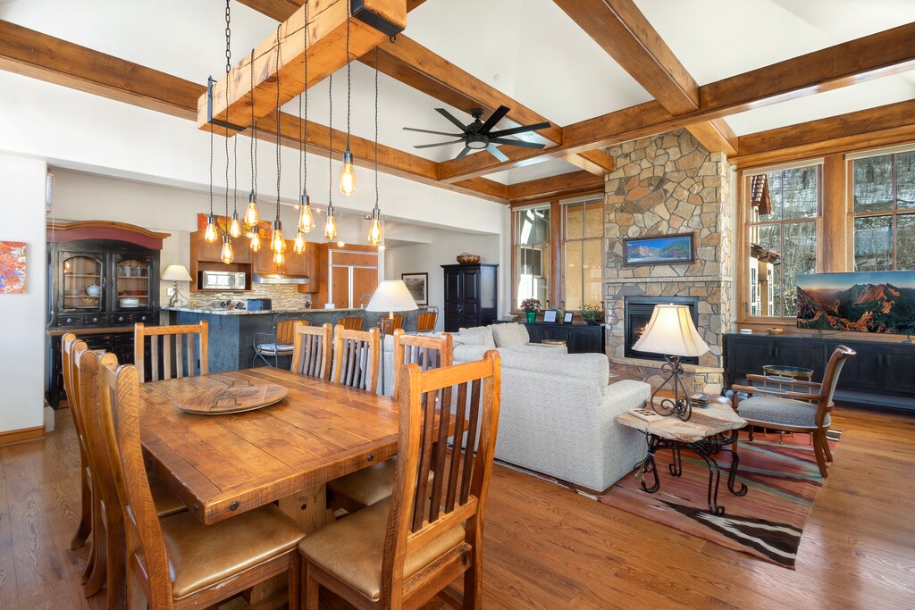 Unwind in this stunning open-concept space where rustic beams meet modern comfort, your perfect mountain retreat.