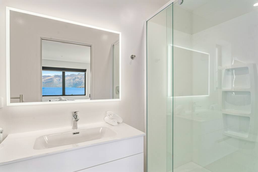 Both bedrooms have their own identical ensuite bathroom, each with a shower.

