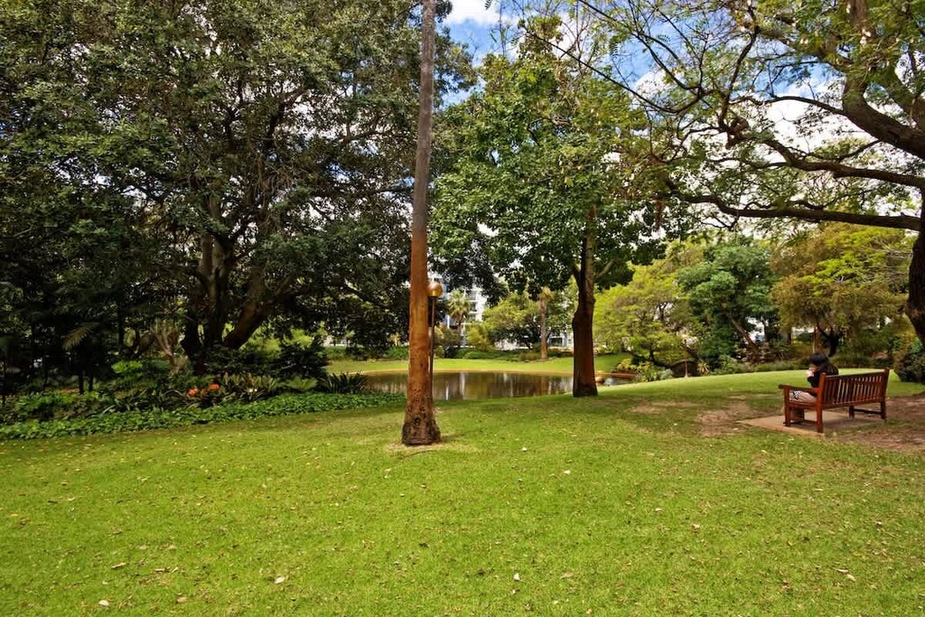Peaceful park setting with open green lawns, shady trees, and a tranquil pond. Ideal for morning strolls, quiet reading, or simply soaking in nature’s calm—just moments from your stay.