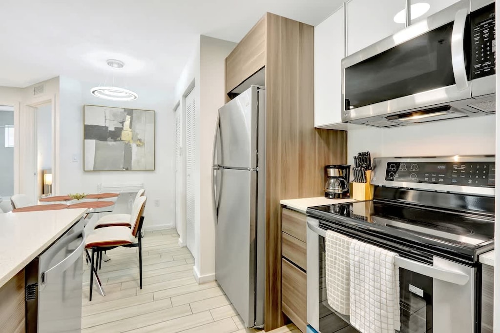 Modern kitchen fully equipped with all appliances and cookware, ready for anything from morning coffee to full dinners.