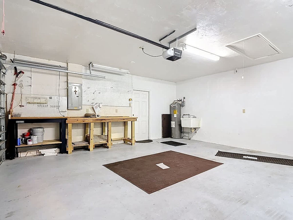 Spacious garage with dual workbenches and ample storage space.