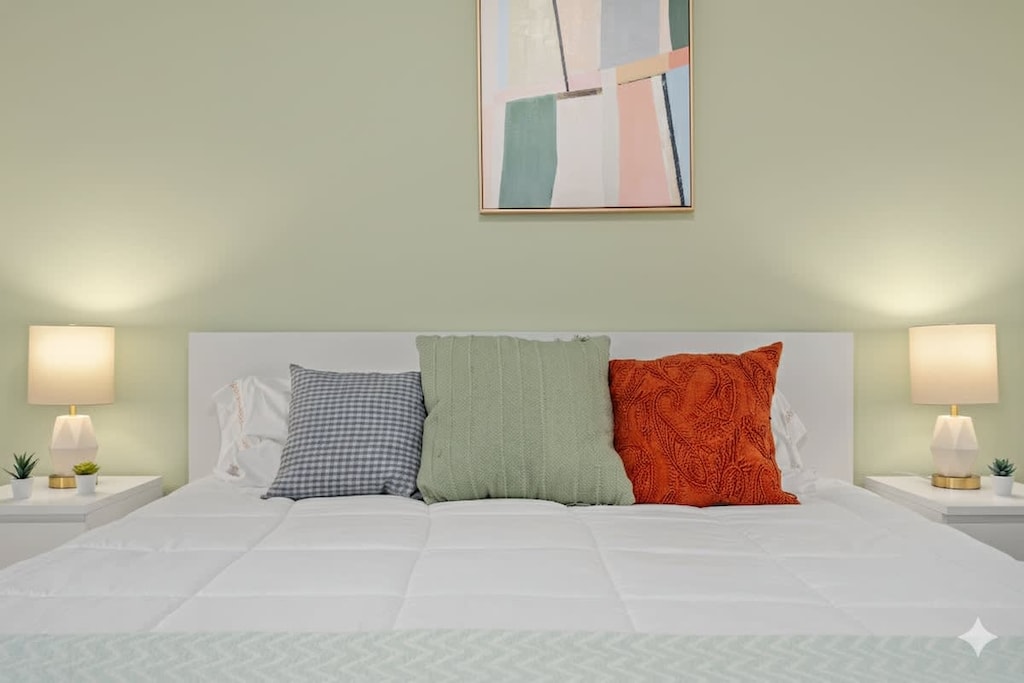 Relaxing bedroom with calming colors and natural light.