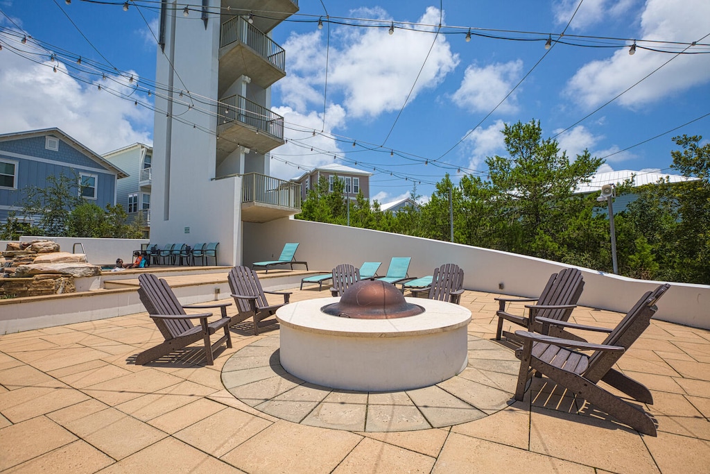 Gather around the rooftop fire pit for memorable evenings under twinkling lights, with comfortable seating for your entire group.