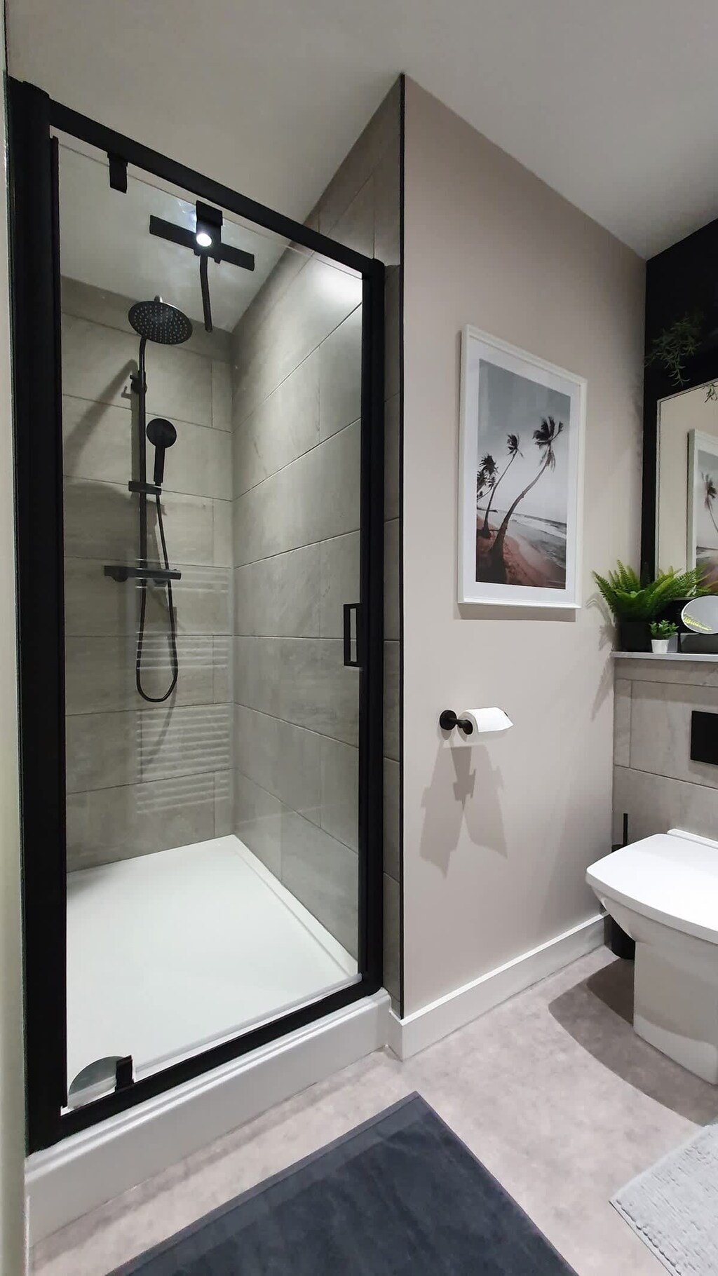 Bathroom with starter pack toiletries and tissue rolls. The water pressure is good, and equipped with hot and cold water.