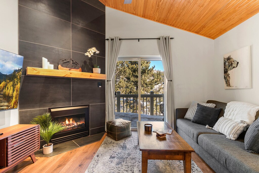 Balcony Access Living Room — Walk out to the balcony from the living room, and enjoy flexible sleeping with a full modular sofa that converts to extra bed space.  ️✨