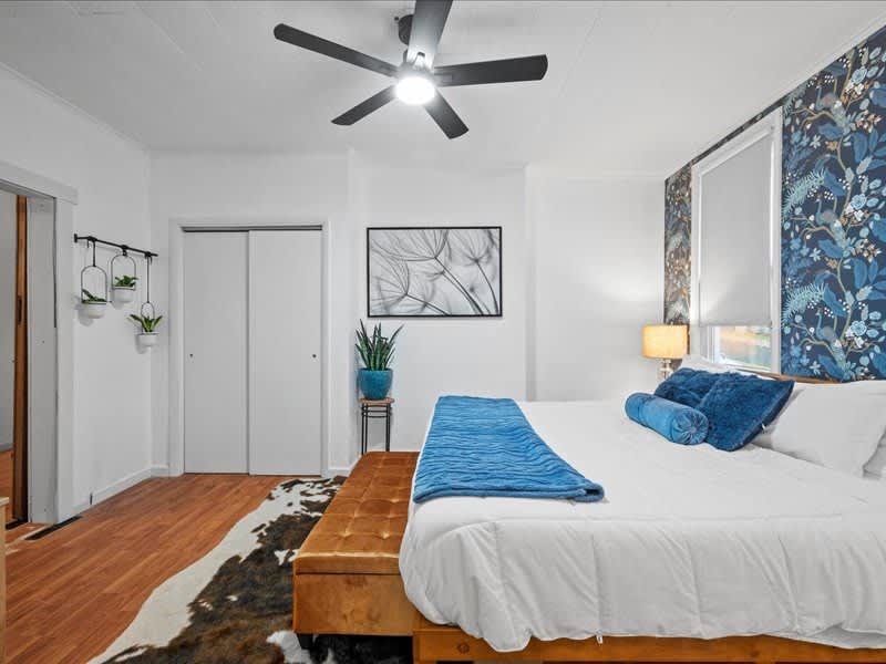 Relax in a spacious, thoughtfully designed bedroom featuring a plush bed and calming details for a restful stay. Professionally managed by Bespoke Stay, every element is curated for comfort, quality, and a seamless guest experience.