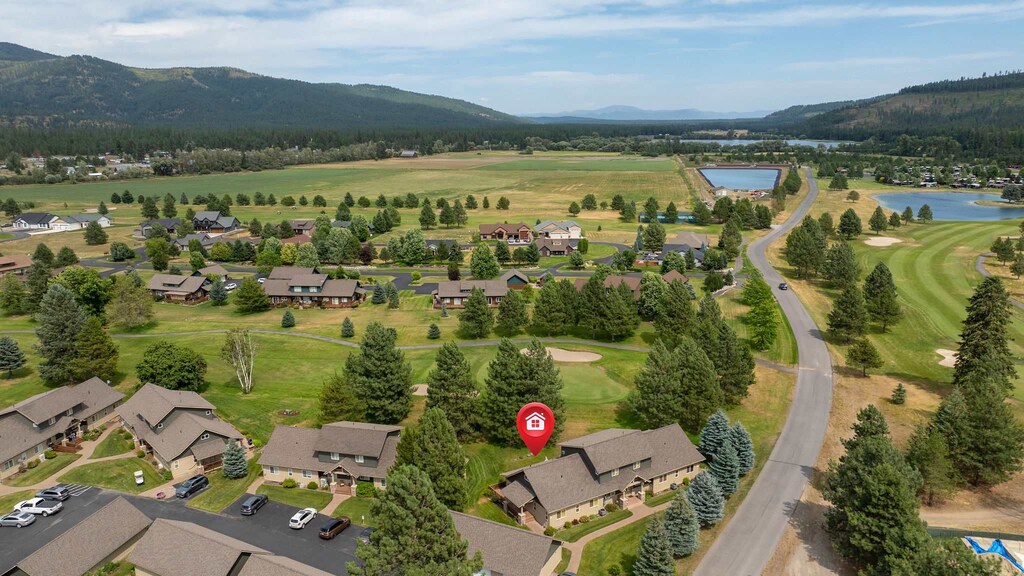 Scenic mountain valley location with golf course views and peaceful residential setting near recreational lake.