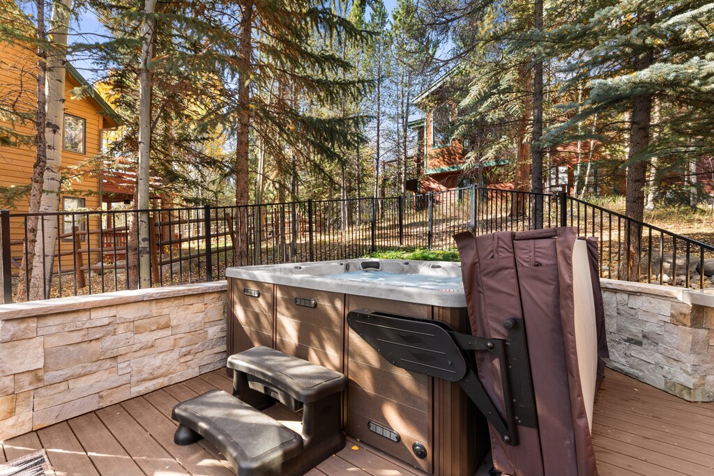 Soak away your cares in your private hot tub, surrounded by towering evergreens and peaceful mountain air—the perfect spot to unwind after a day of adventure.
