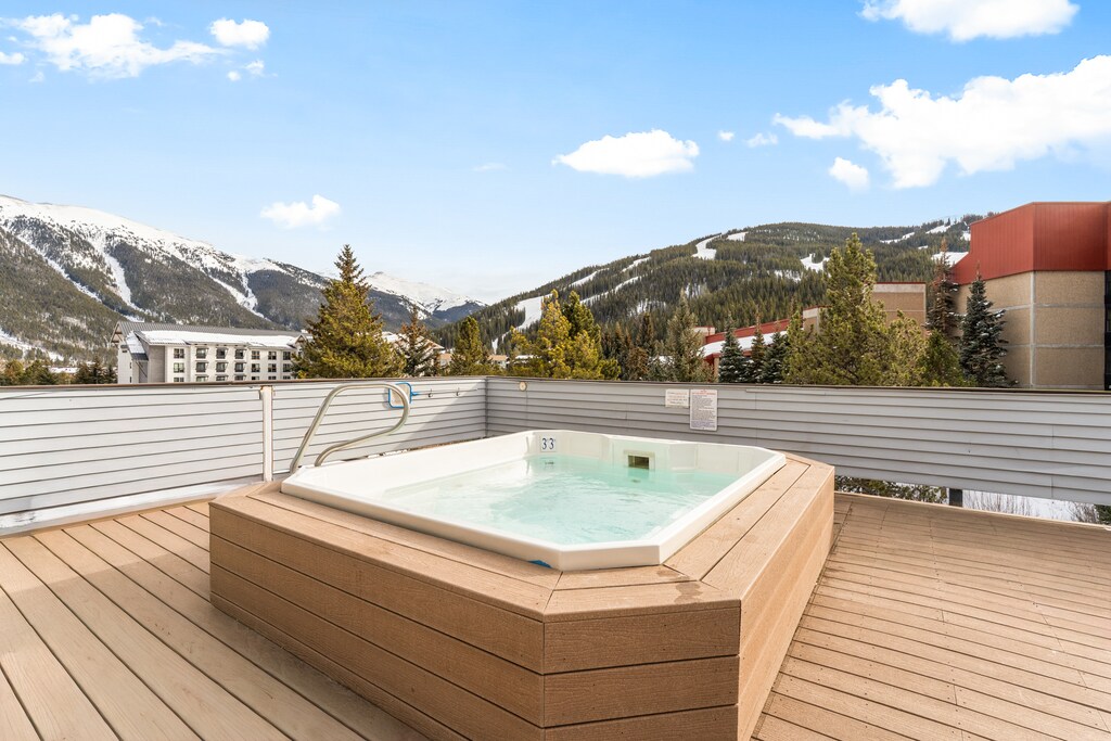 Soak in your private hot tub while taking in breathtaking snow-capped mountain views from this stunning rooftop terrace.