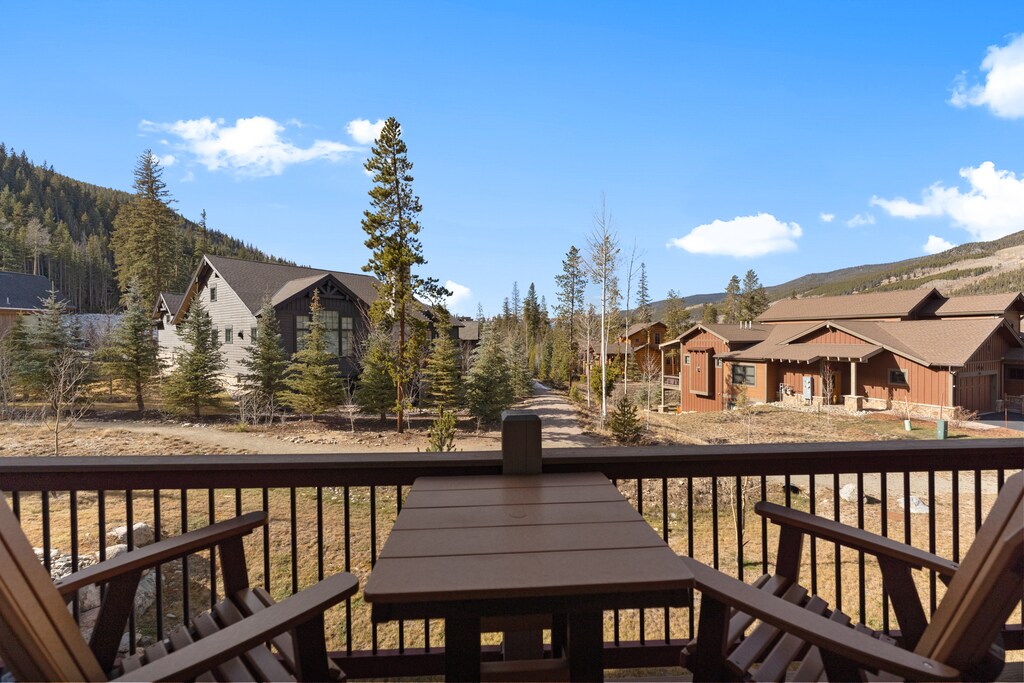 Sip your morning coffee on this private balcony while taking in stunning mountain views and peaceful neighborhood scenery.