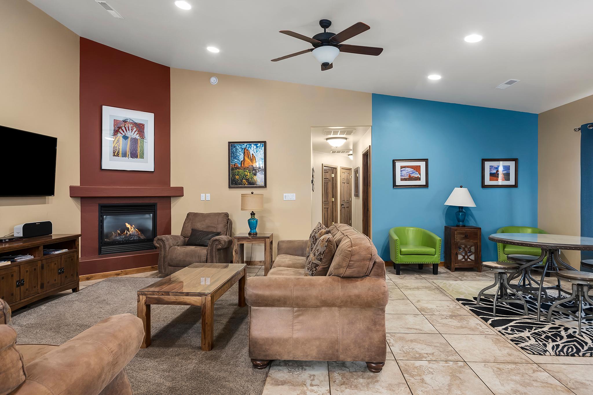 Beautiful open concept living space with plenty of seating and a gas fireplace