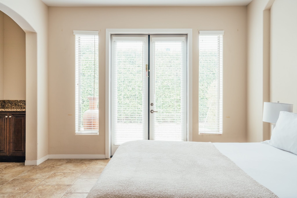 Interior shot of bedroom 2 with patio access.