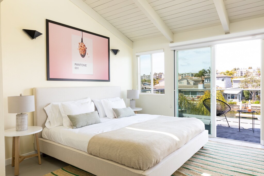 Primary Bedroom with patio access and comes witth a king bed.