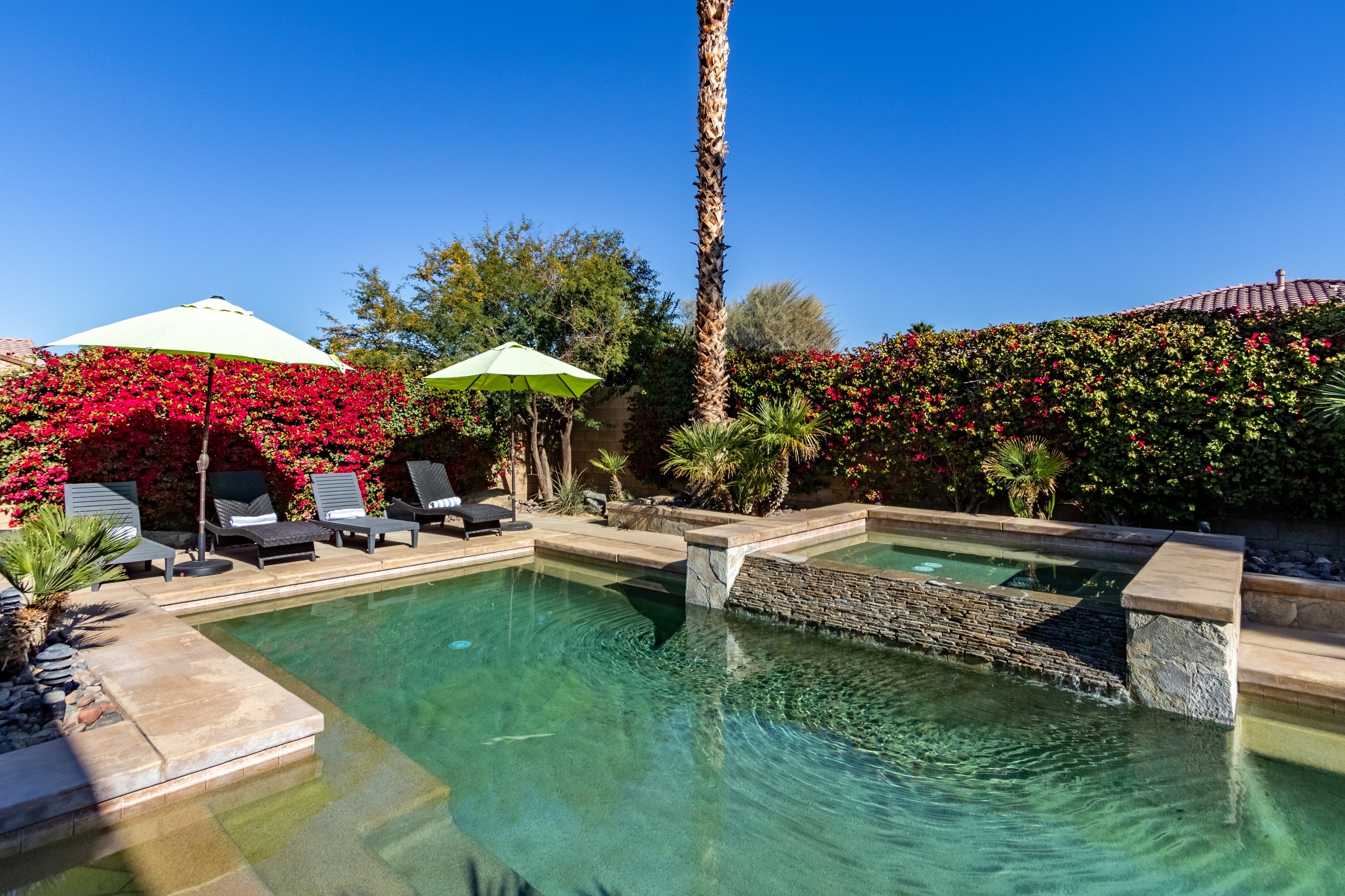 Beautiful outdoor pool and hot tub.