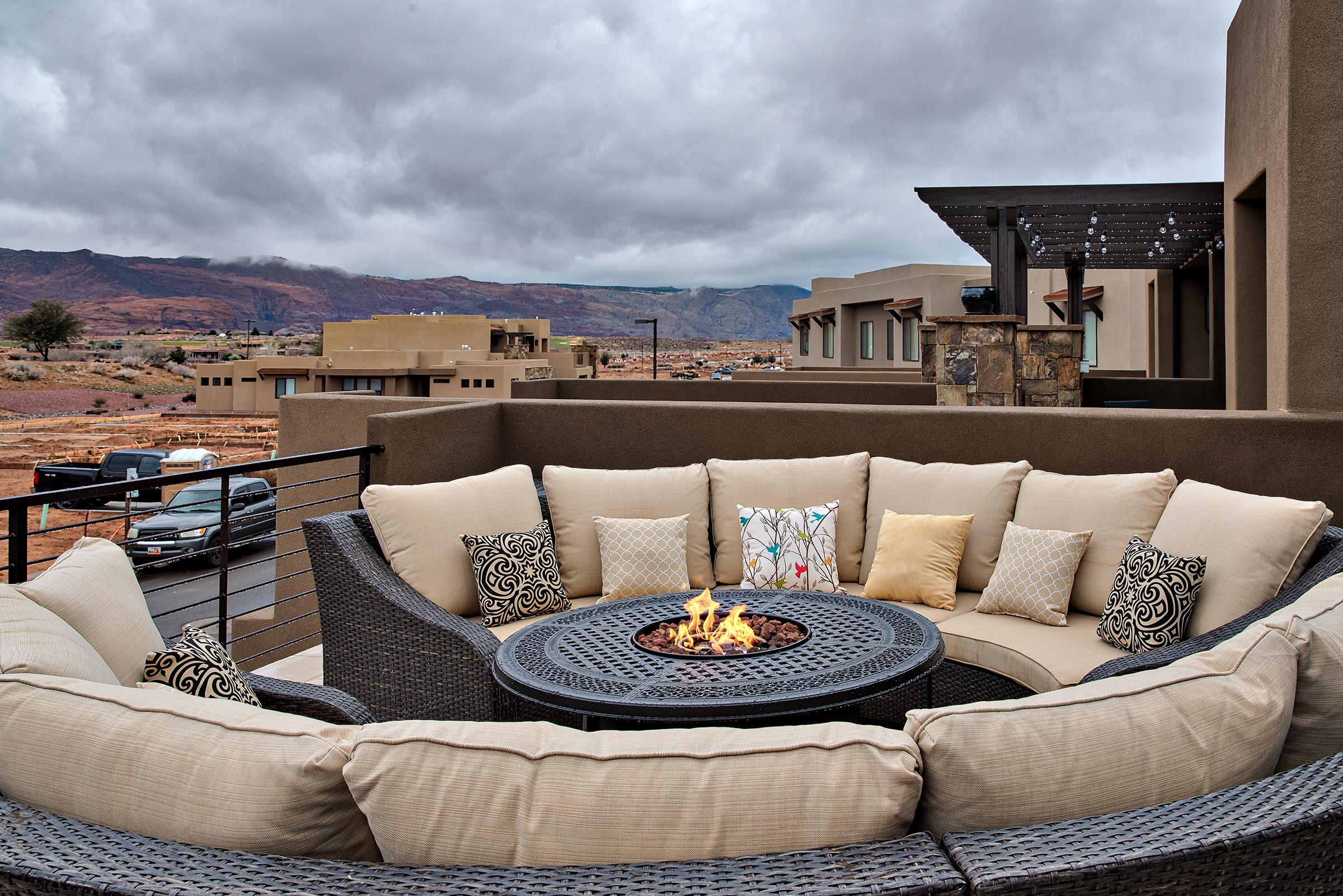 Stay warm next to the firepit and relax while watching the sunset over the red mountains.