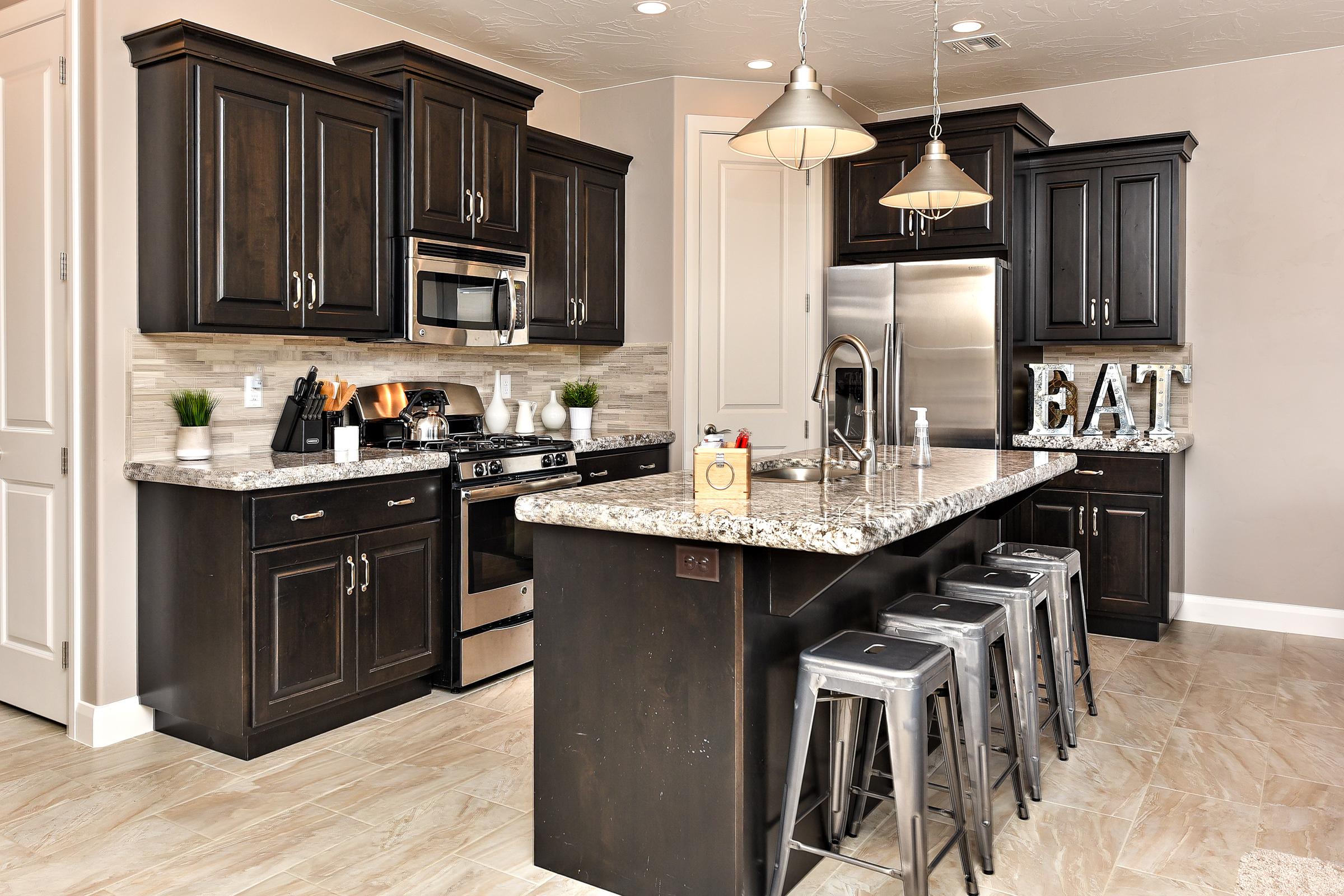 The Kitchen is fully stocked with all the dishes, cookware, baking pans, and cutlery you will need for meal preparations and includes stainless steel appliances and granite counter tops. 