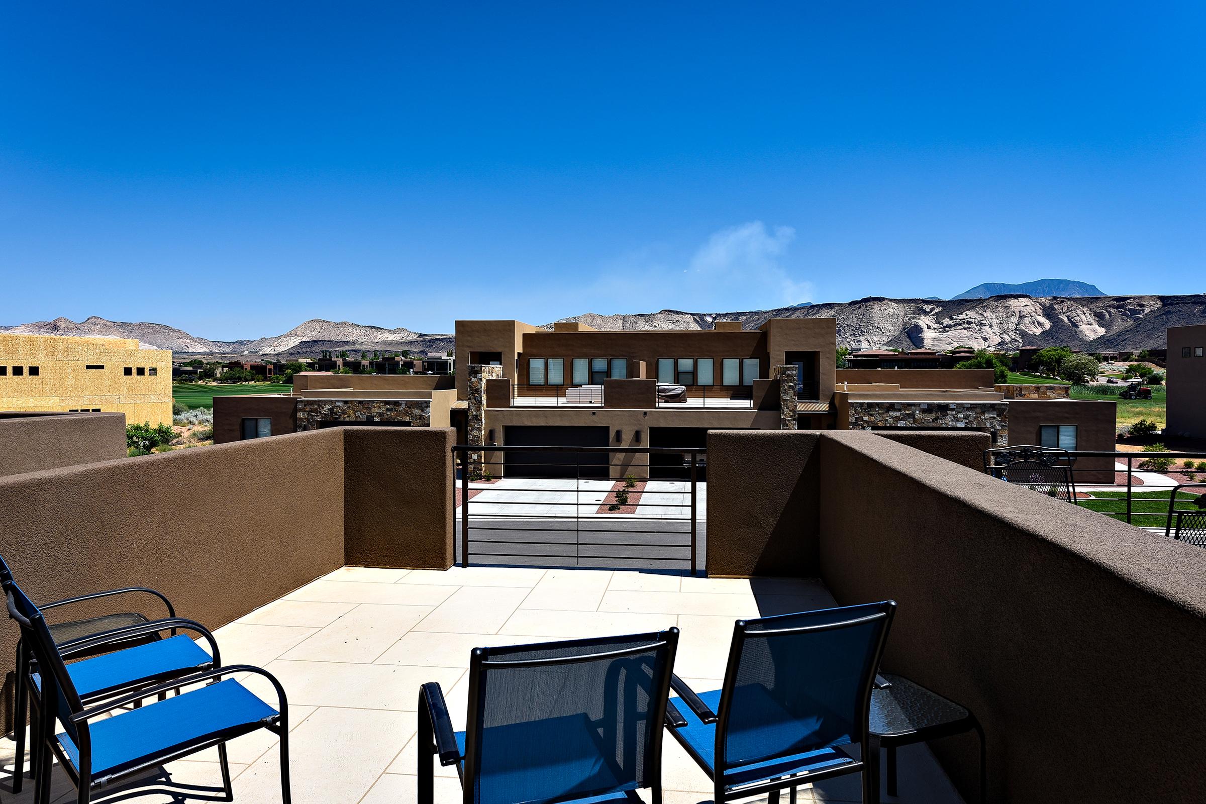 The Front Patio offers comfortable lounging with views of the 18th hole at The Ledges Golf Club. 