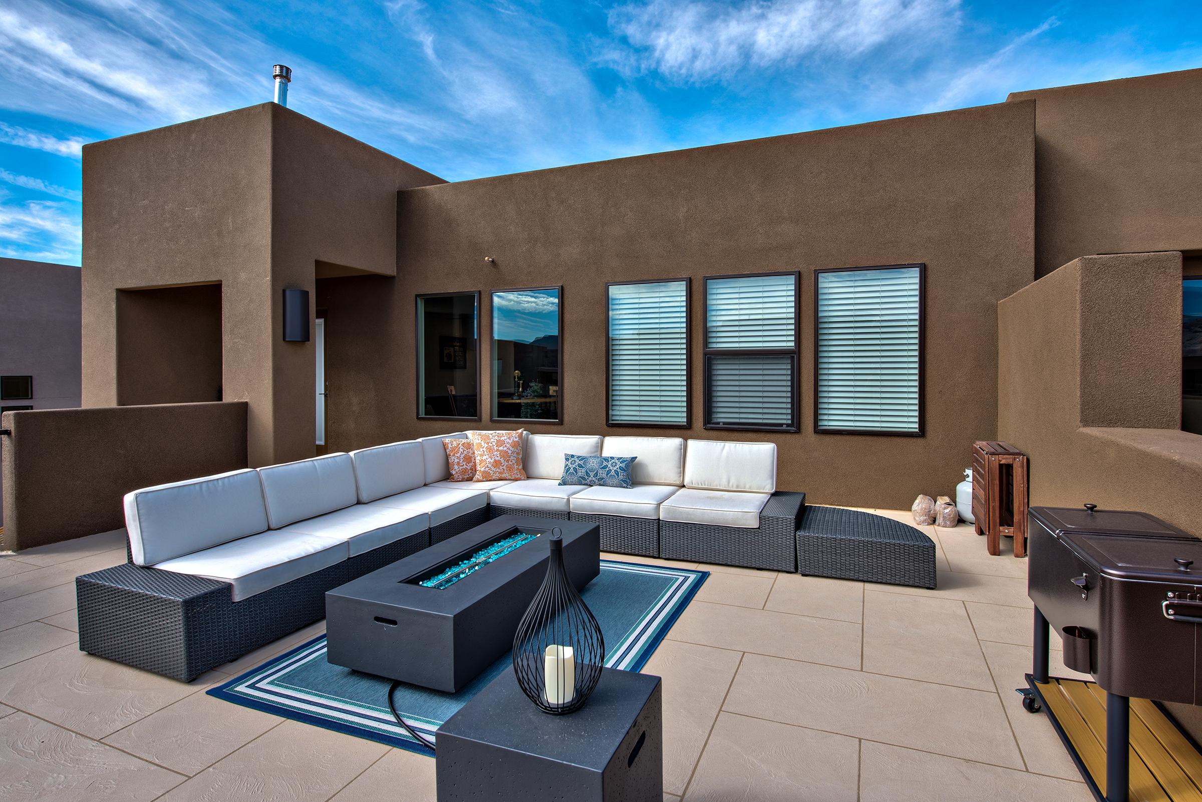 Stay warm next to the gas firepit and relax while watching the sunset over the red mountains.
